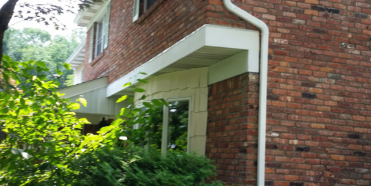 2nd Floor downspout on brick